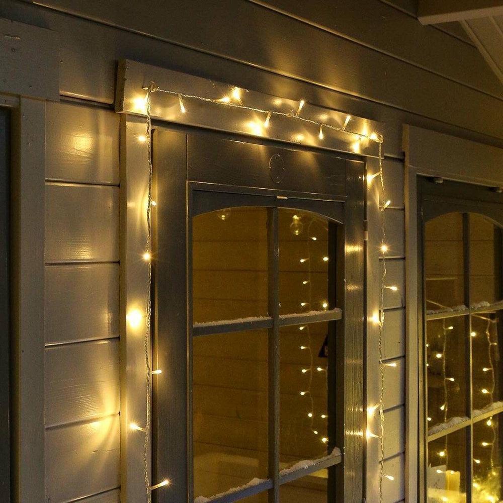 Instalatie Craciun, 10 m, 100 Led-uri, Liniara, Alb cald, 8 jocuri de lumini, Transformator cu telecomanda, Interconectabila, Prelungitor 3 m inclus, Fir Transparent